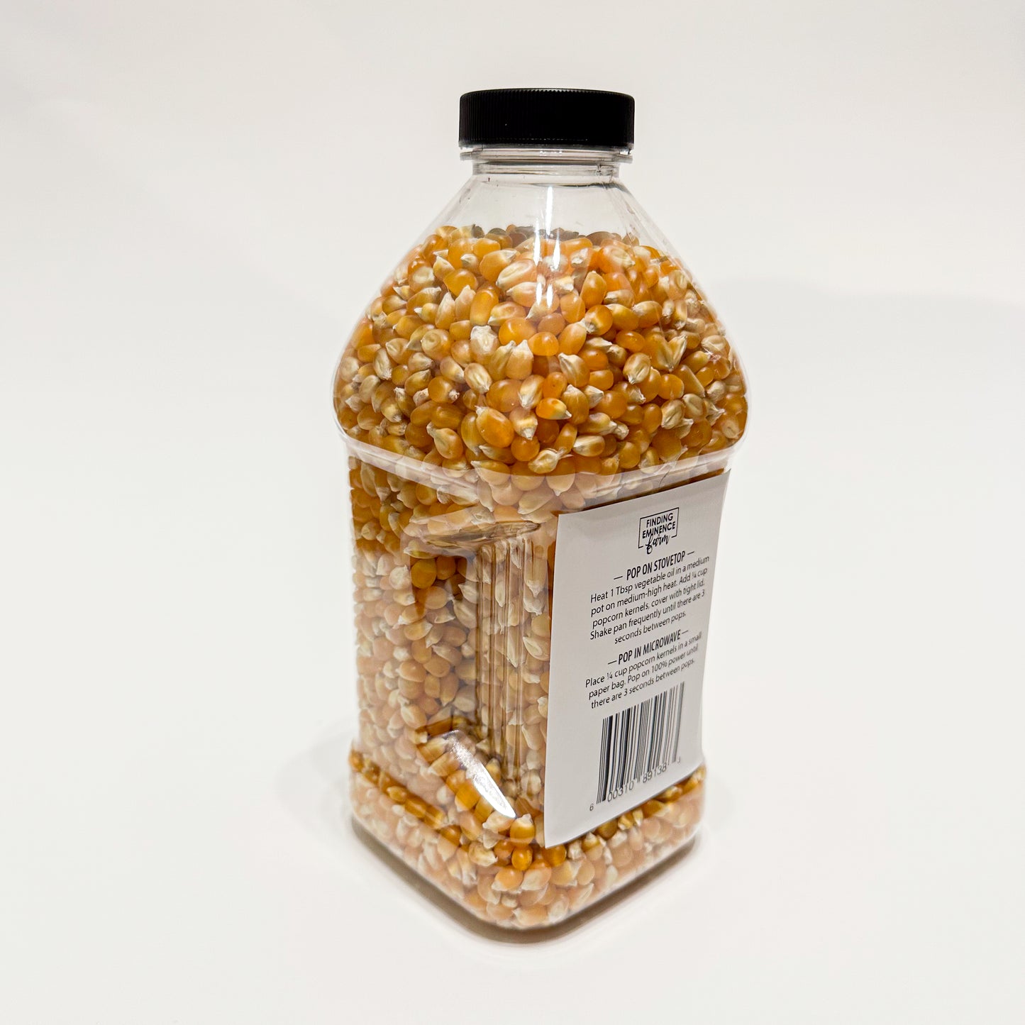 Back of bottle of butterfly popcorn with screw top lid. 