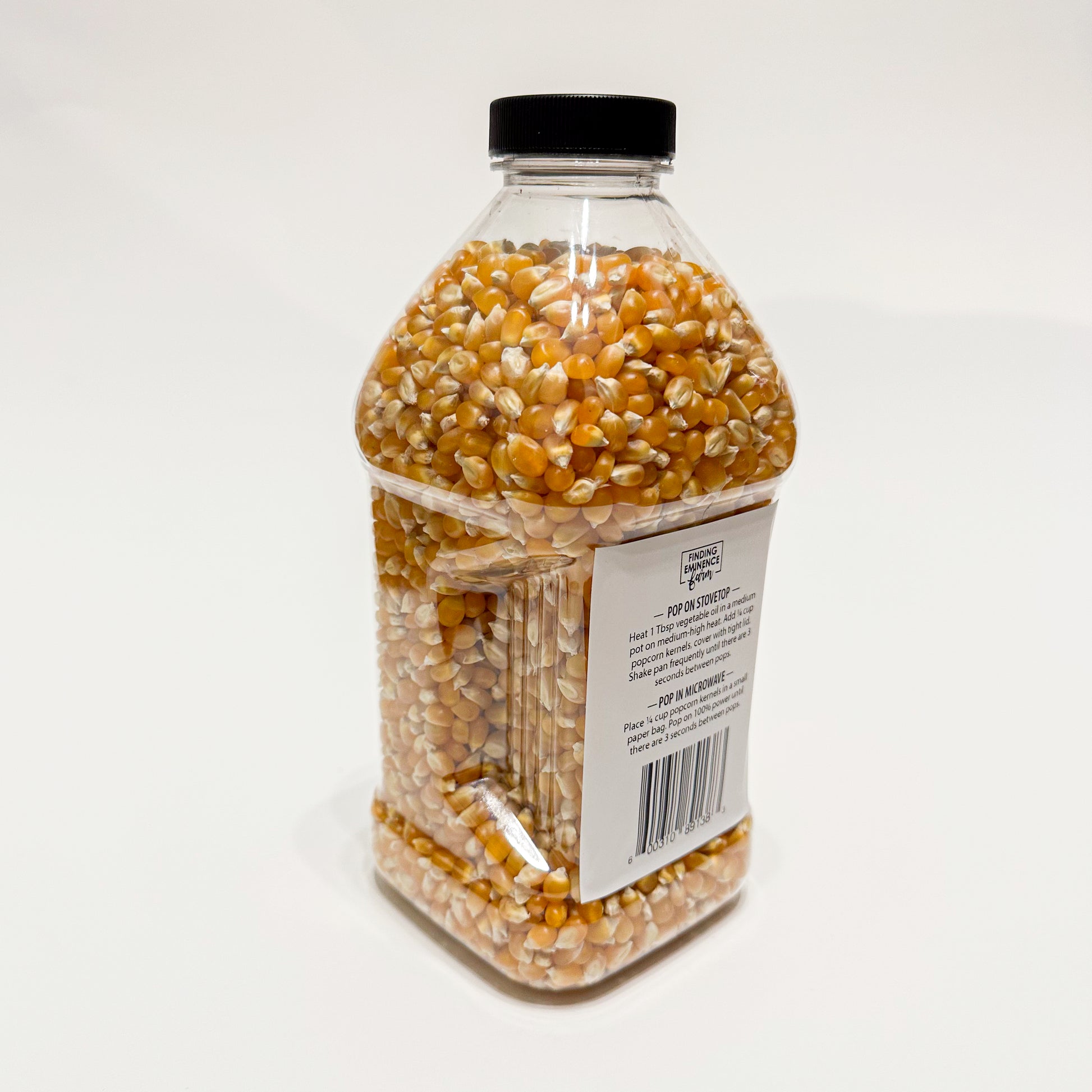 Back of bottle of butterfly popcorn with screw top lid. 