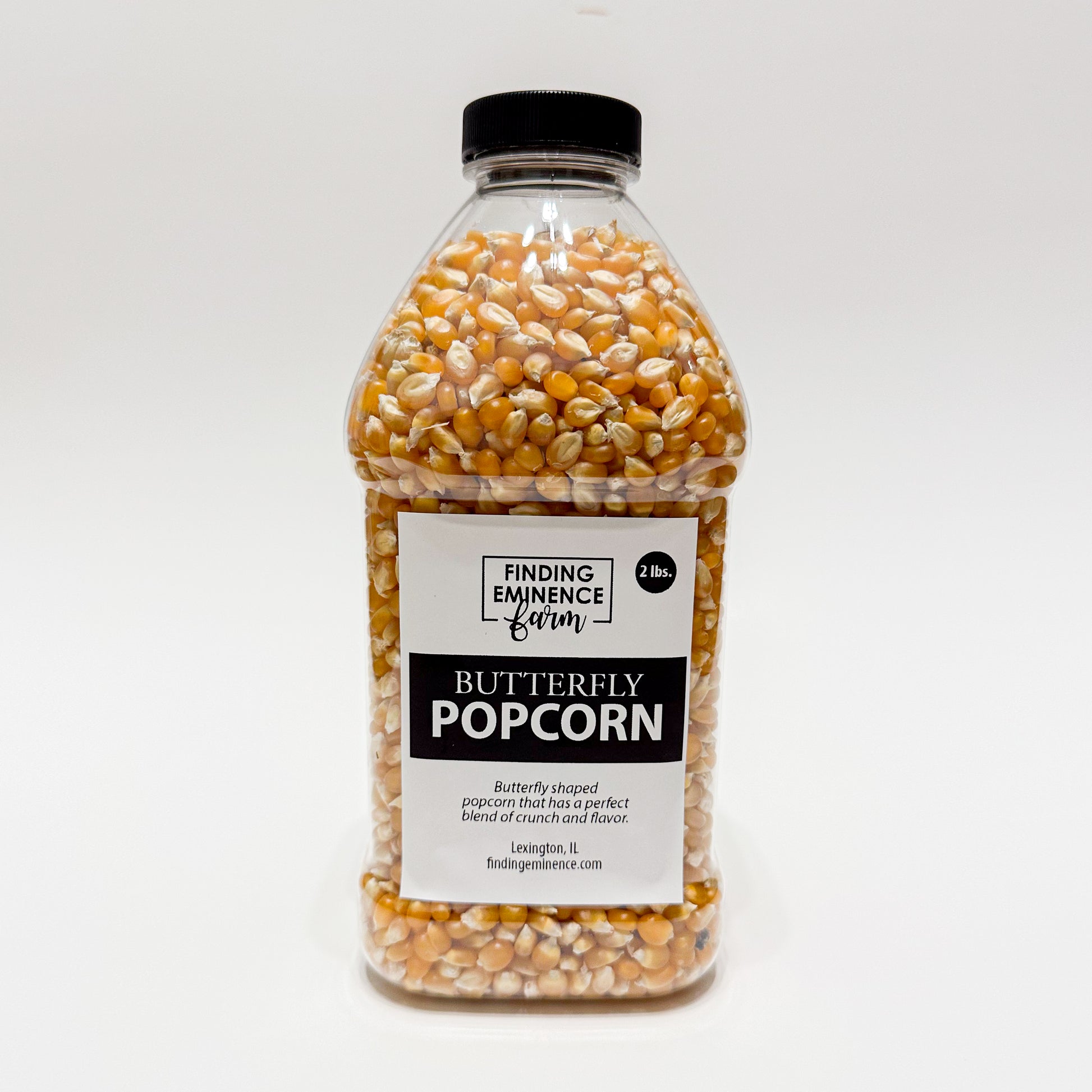 Bottle of butterfly popcorn with black screw top lid. 